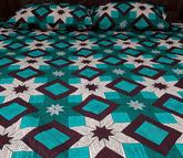 Naqsh-e-Rung β Teal & Maroon Geometric Quilted Bedspread